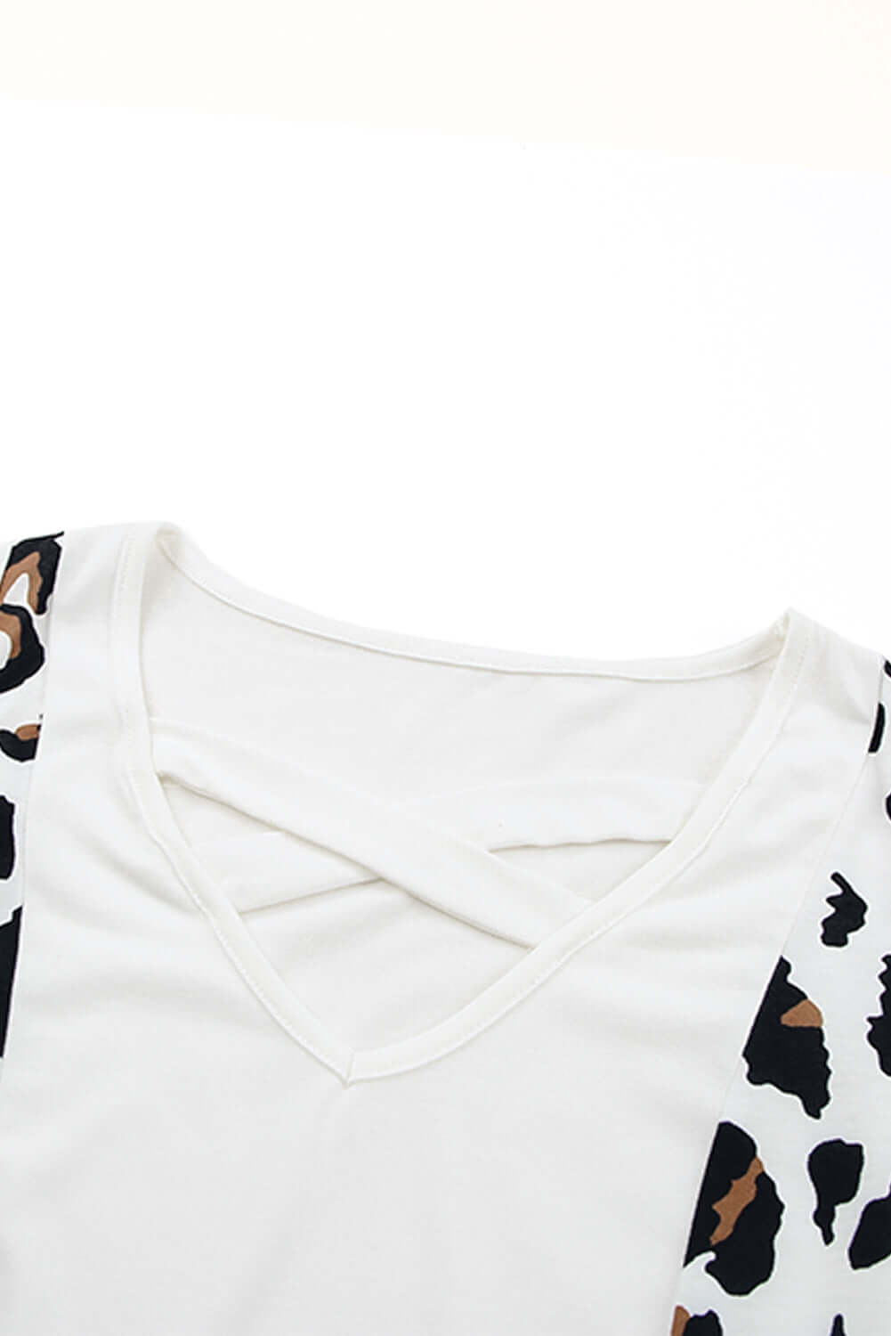 Crisscross Leopard Splicing Tank Top showing bold leopard print design and stylish V-neck crisscross detail.