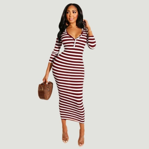 Stylish woman in a sexy striped midi bodycon dress, perfect for autumn winter fashion, showcasing bold stripes and a flattering fit.