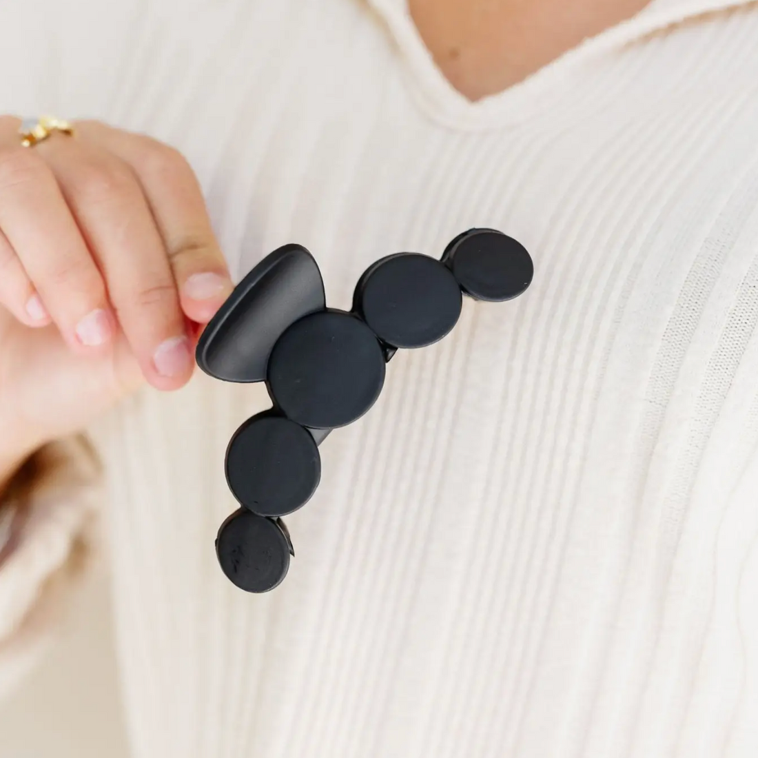 Large 4 inch matte black claw clip with circle design, view 2
