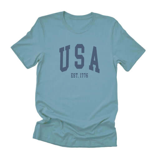 Soft unisex short sleeve t-shirt in light blue, featuring &