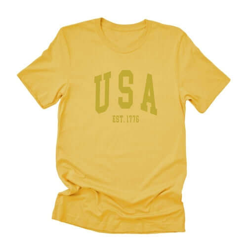 USA Est 1776 short sleeve t-shirt in yellow, soft cotton with a relaxed fit for casual style.