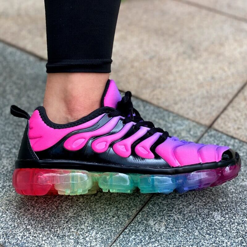 Stylish pink and black running sneakers with colorful transparent sole, perfect for women’s summer workouts.