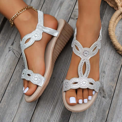 Stylish silver platform sandals with embellishments, perfect for casual summer outings and comfortable wear.
