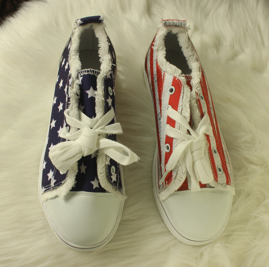 Star striped lace-up sneakers with round toes, featuring red and blue patriotic design, casual footwear for everyday wear.