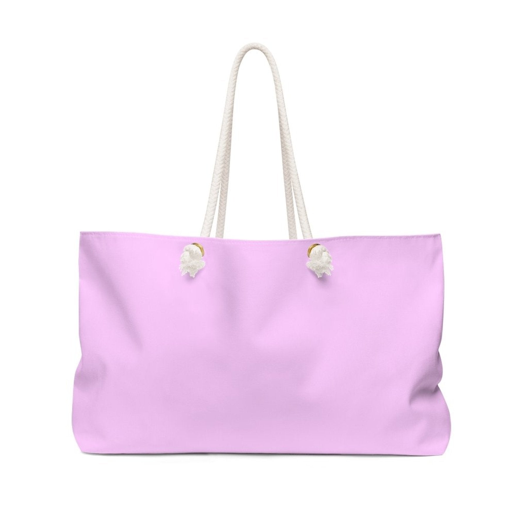Light pink oversized Weekender Tote bag with thick rope handles, perfect for beach trips or weekend getaways.