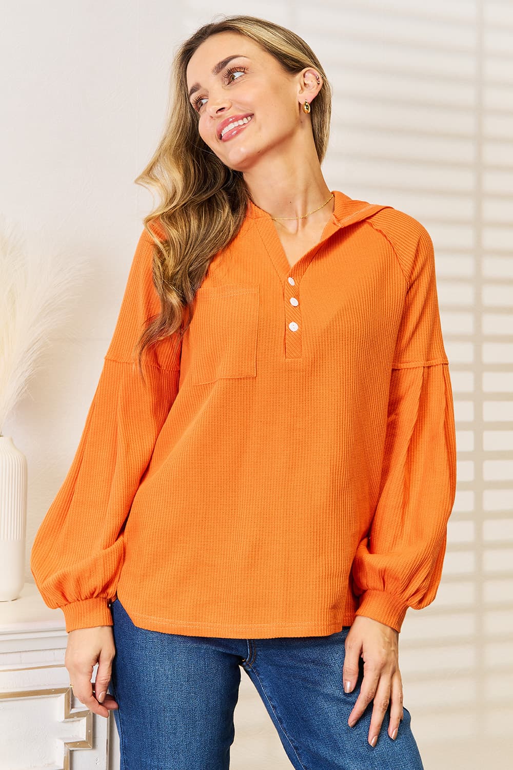 Women's orange waffle knit hoodie with side slits