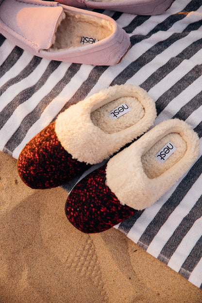 Wine red knit slippers with faux fur cuff, worn view