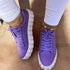 Purple breathable platform sneakers with lace detailing, ideal for casual style and comfort.