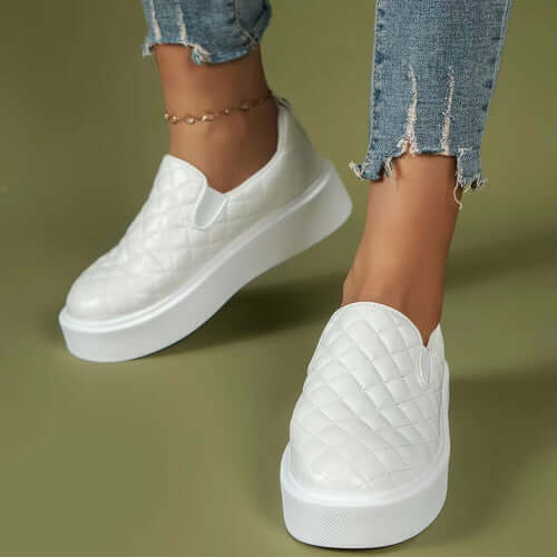 Stylish white slip-on platform loafers with quilted design, perfect for casual outfits and everyday wear.