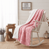 Pink faux fur throw blanket with rose bud texture and white sherpa back