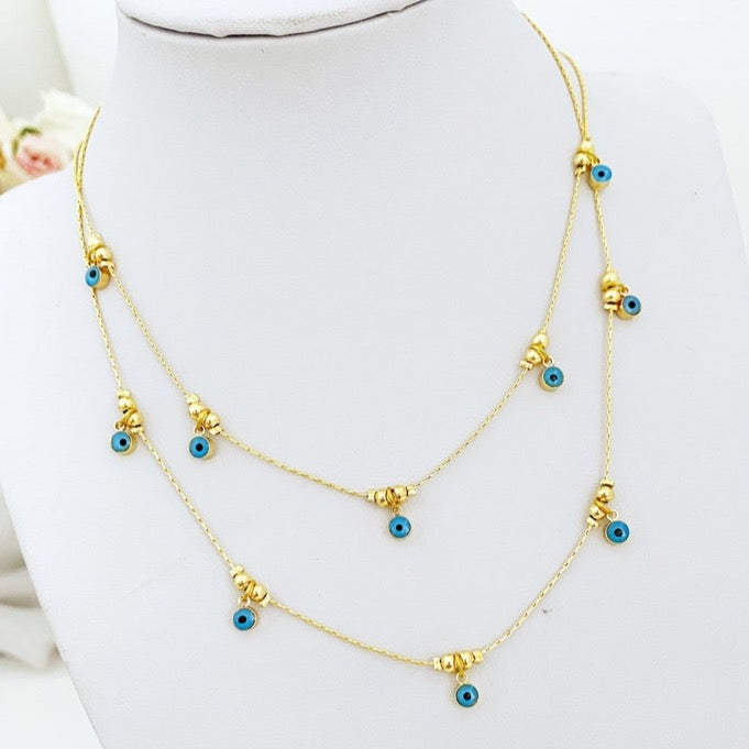 Dainty blue evil eye necklace on gold chain