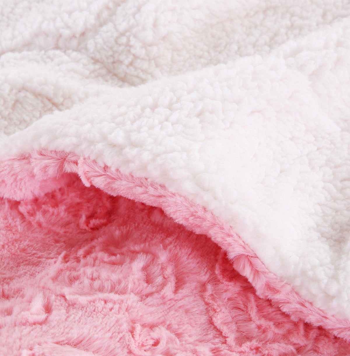Pink faux fur throw blanket with rose bud texture and white sherpa back, view 7