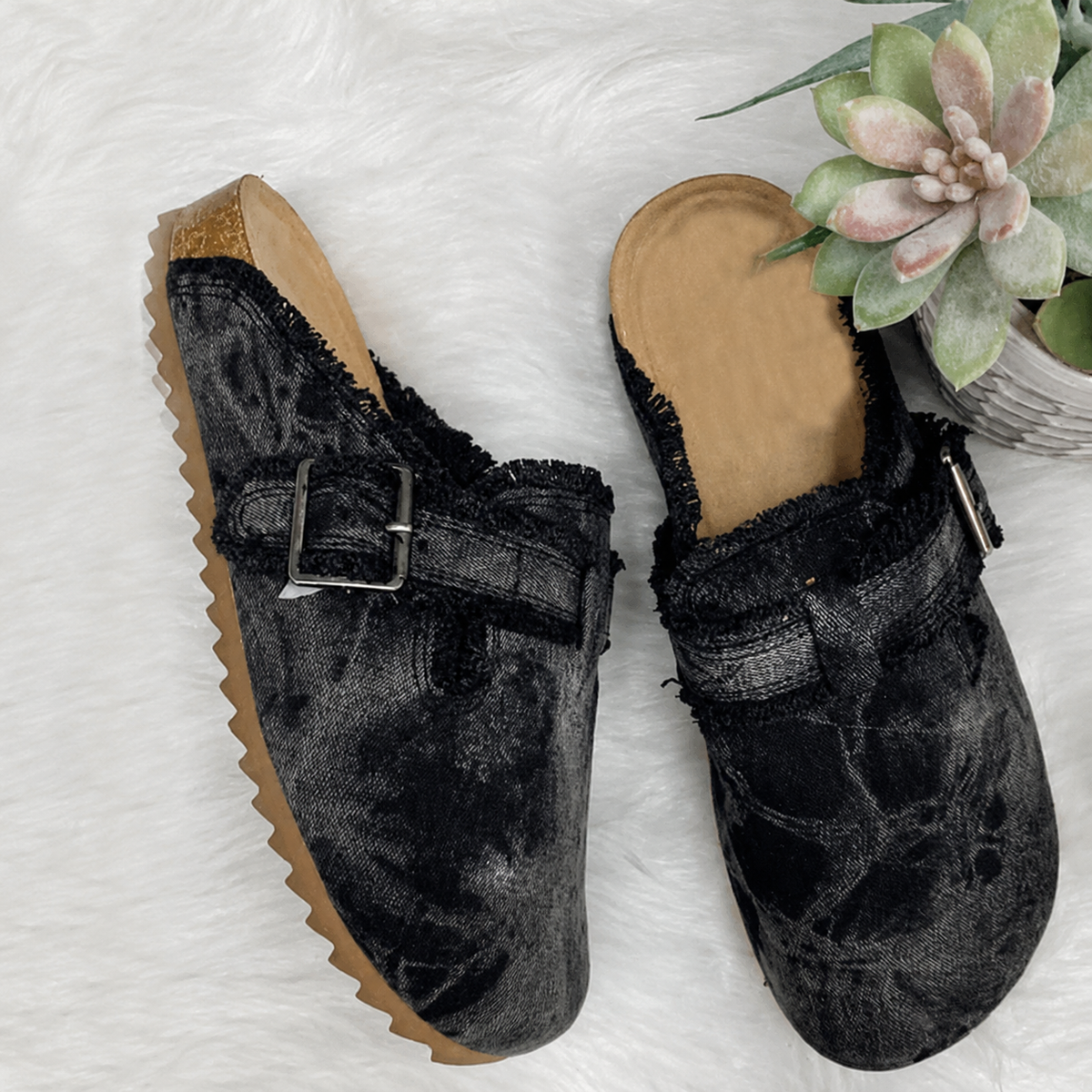 Black vintage canvas loafers with buckle detail, perfect for stylish and casual outfits.